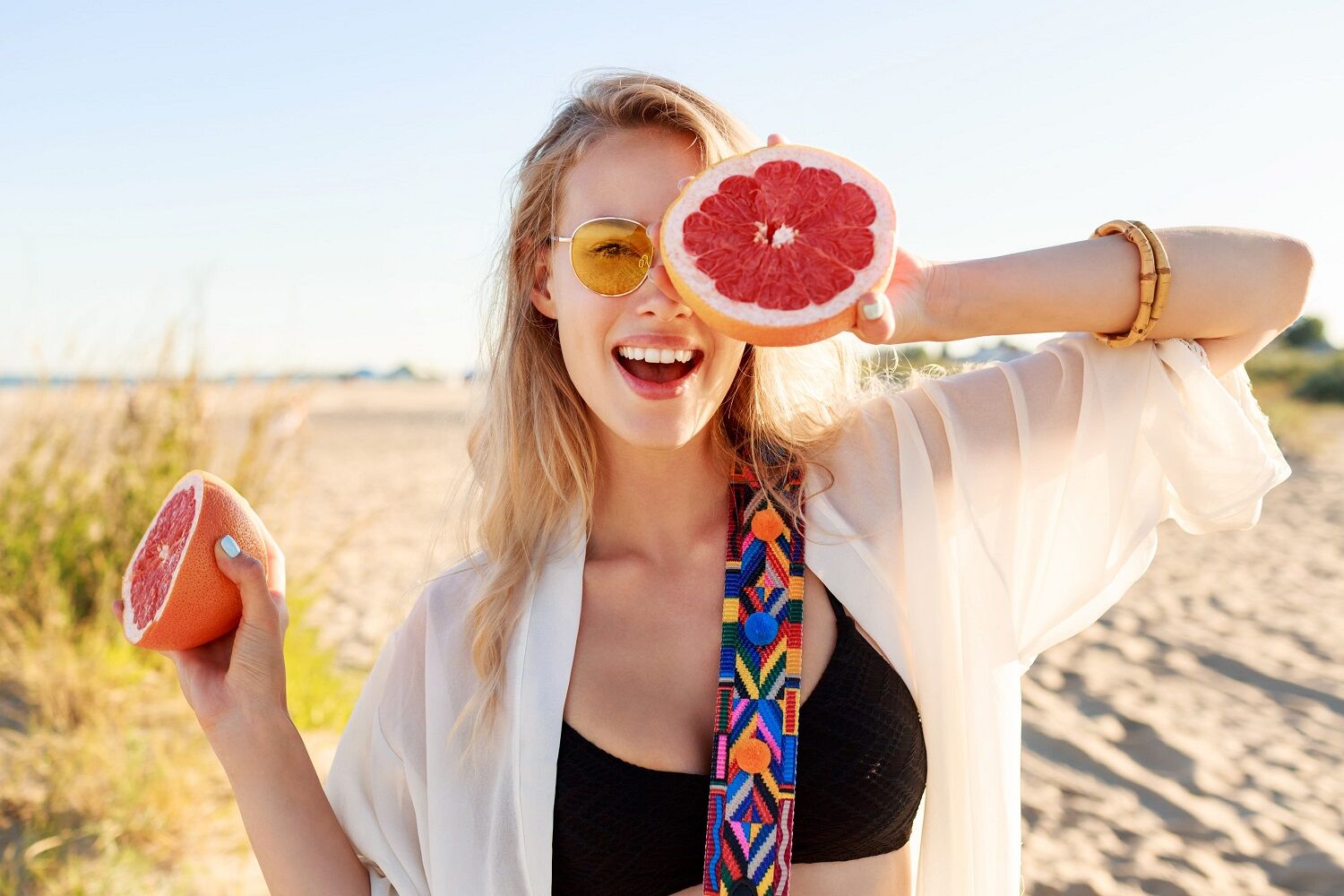 1784180461 Happy Blonde Natural Woman Holding Grapefruit Healthy Diet Food Summer Vacation (1)